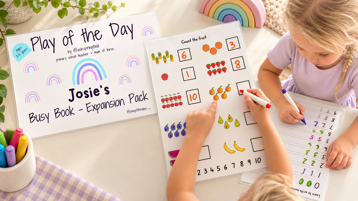 Personalised Busy Book Expansion Pack with a child counting fruit on a laminated page